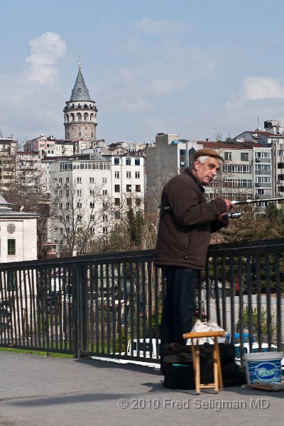 20100401_151209 D300.jpg - Fishing on Galata Bridge.  Galata Tower in background